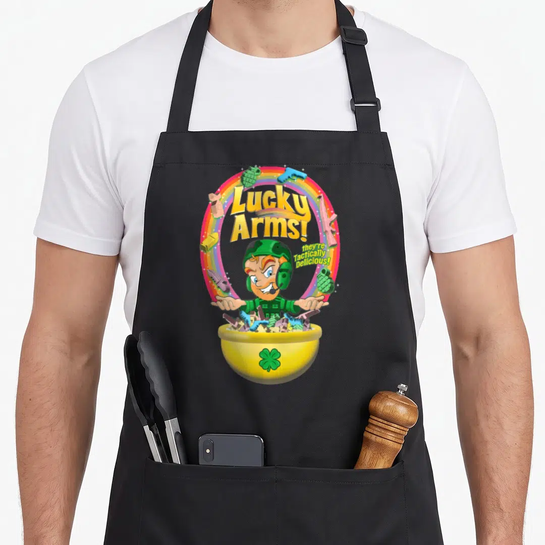 Arm st patrick day aprons - Cartoon soldier behind yellow bowl with Lucky Arms text and rainbow border — shown on a black cotton canvas apron against a white background