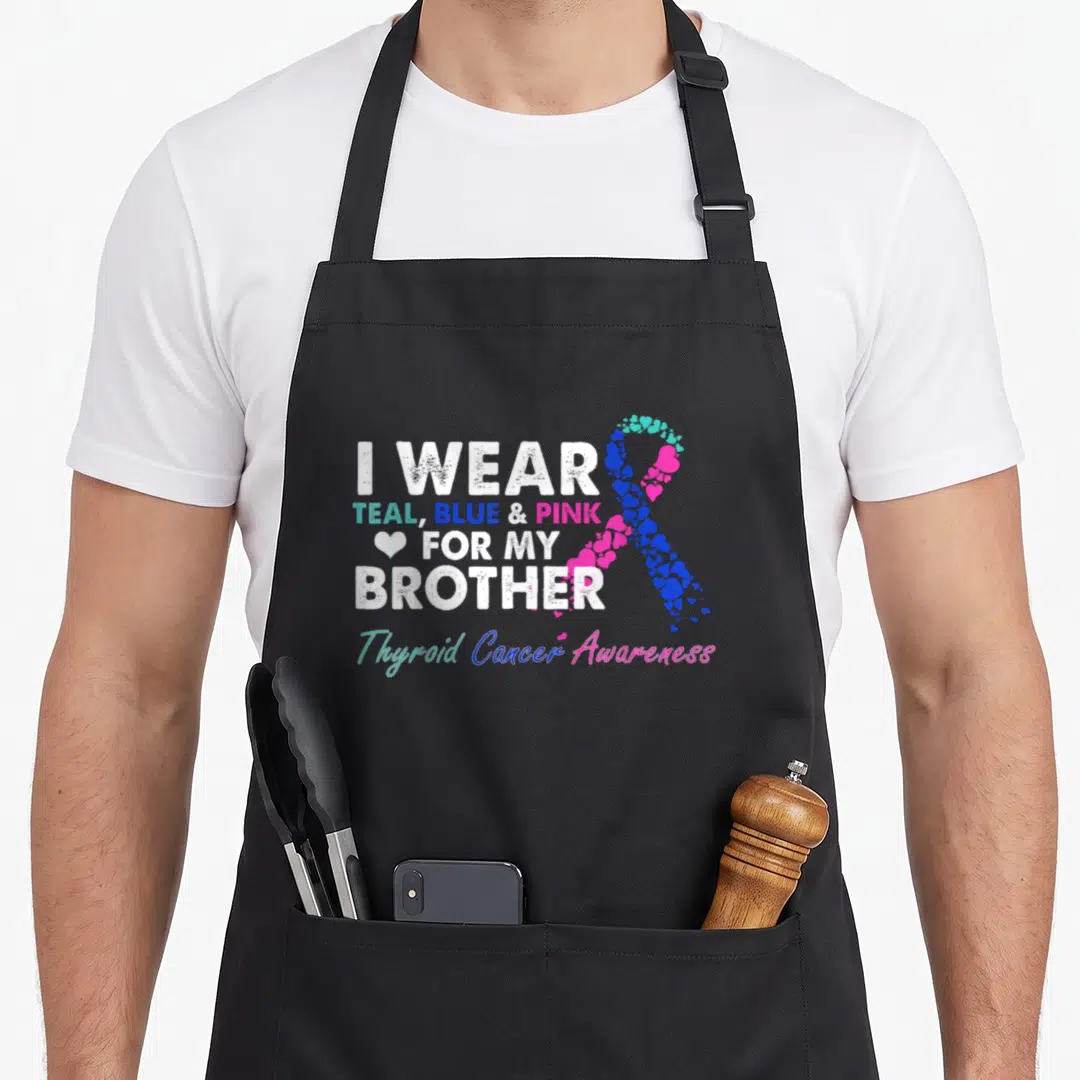 Costume ribbon apron - I Wear Teal Blue Pink For My Brother thyroid cancer awareness ribbon with hearts — shown on a black cotton canvas apron against a white background