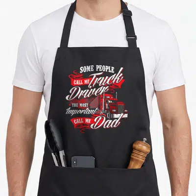 Driver trucker semi truck apron - Red truck illustration with distressed white text reading Call Me Dad on ribbons — shown on a black cotton canvas apron against a white background