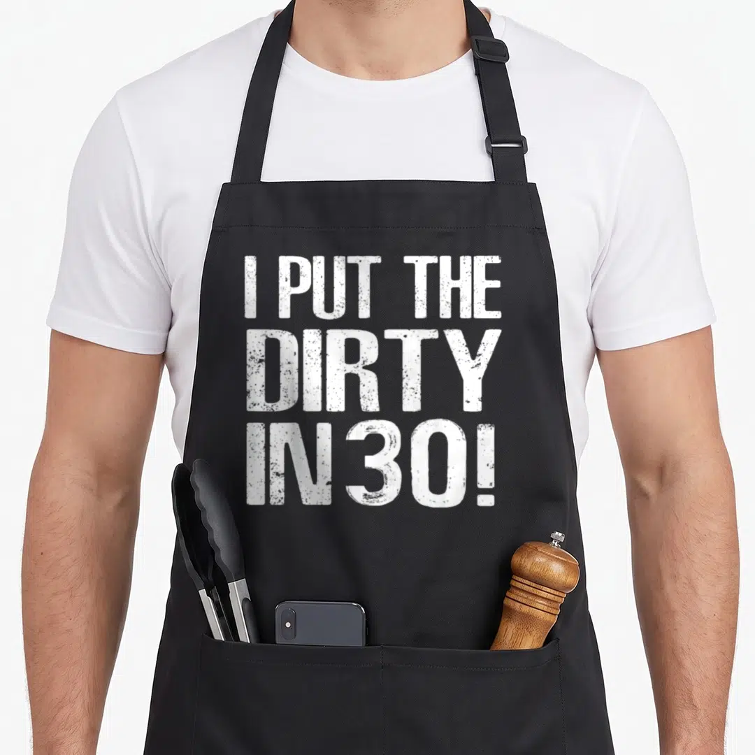 Thirty 30th funny dirty aprons - White stacked text I PUT THE DIRTY IN 30! in distressed font — shown on a black cotton canvas apron against a white background