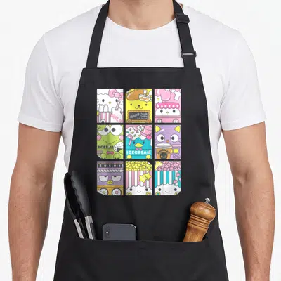 Foodie kawaii apron - Nine-panel grid of cartoon characters labeled CAFE, BAKERY, MILK, RICE BALL, ICECREAM, and SUSHI — shown on a black cotton canvas apron against a white background