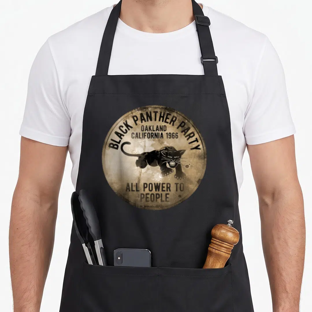 Cute oakland apron - Black panther in tan circle with Black Panther Party Oakland 1966 All Power to People text — shown on a black cotton canvas apron against a white background