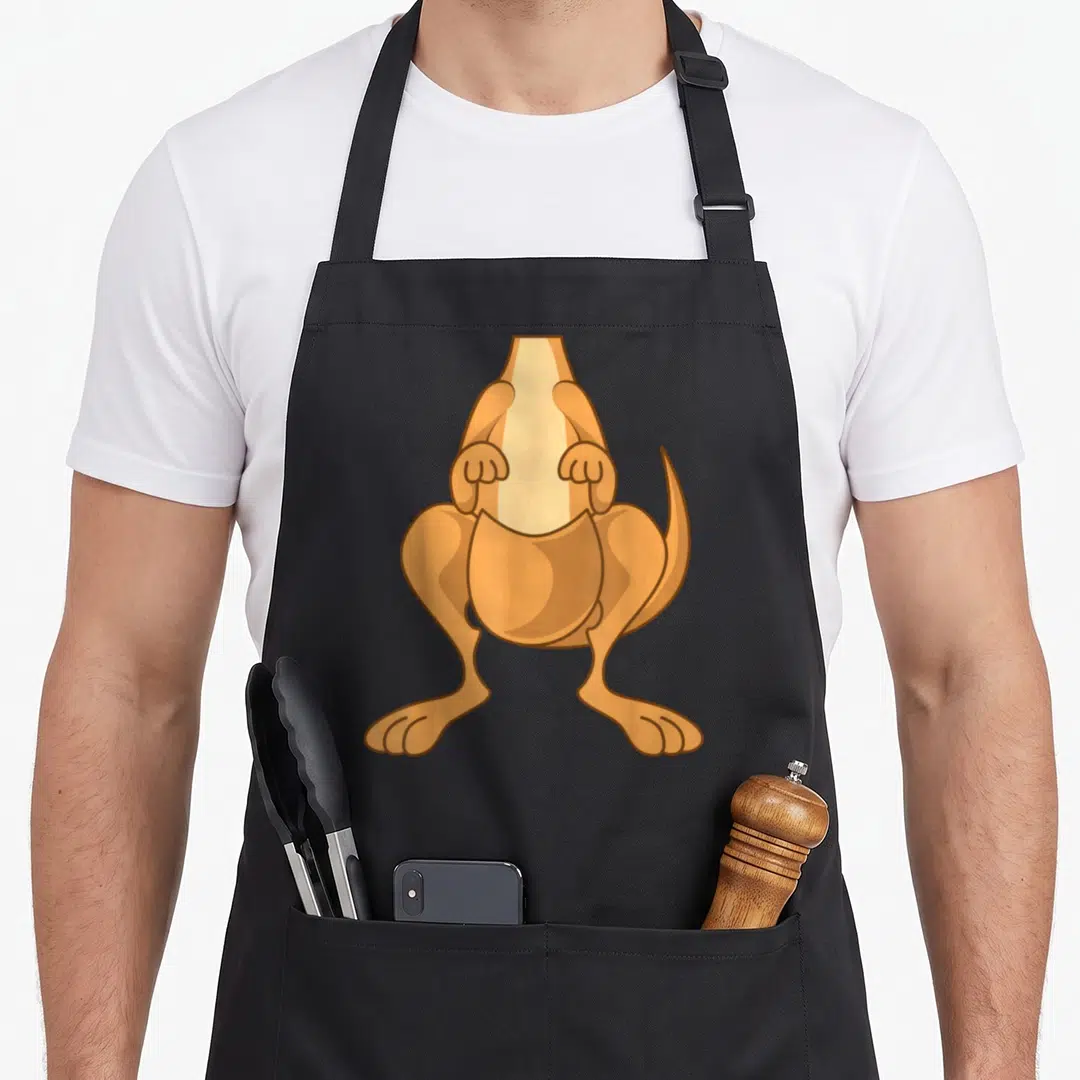 Costume kangaroo apron - Tan and brown cartoon dog merging with a bottle shape creating a kangaroo illusion — shown on a black cotton canvas apron against a white background