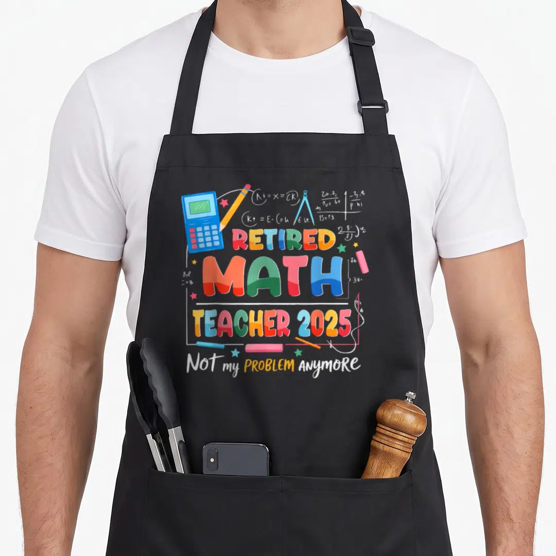 Anymore teacher apron - Retired Math Teacher 2025 text with calculator, pencil, and formulas in cartoon style — shown on a black cotton canvas apron against a white background