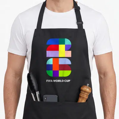 Fifa soccer birthday apron - Multicolored geometric 2026 logo above white FIFA WORLD CUP text — shown on a black cotton canvas apron against a white background
