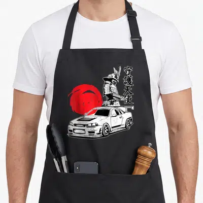 Car japan apron - White tuning car, samurai warrior, red sun circle, vertical black kanji characters — shown on a black cotton canvas apron against a white background