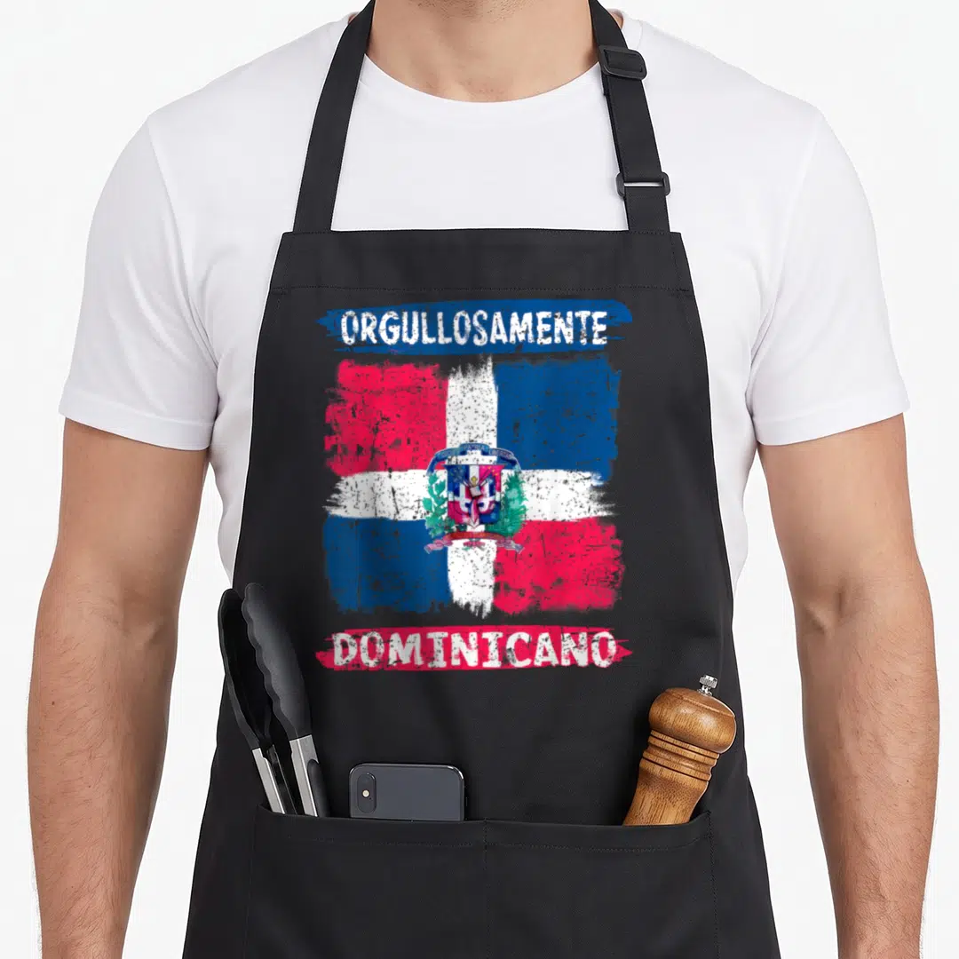 Flag the painted apron - Distressed Dominican Republic flag with ORGULLOSAMENTE DOMINICANO text in red white and blue — shown on a black cotton canvas apron against a white background