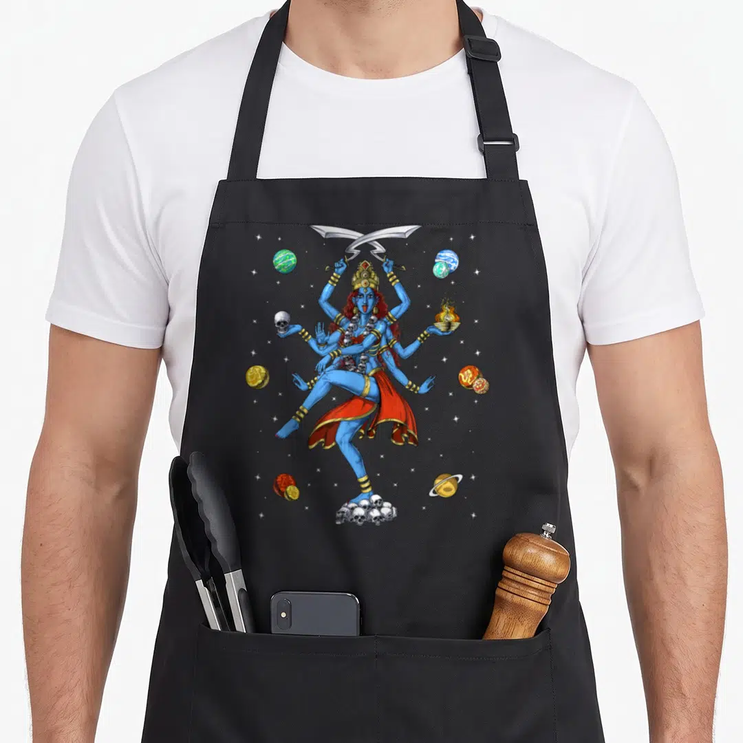 Kali yoga spiritual apron - Blue multi-armed deity holding swords and skull standing on skulls among planets — shown on a black cotton canvas apron against a white background