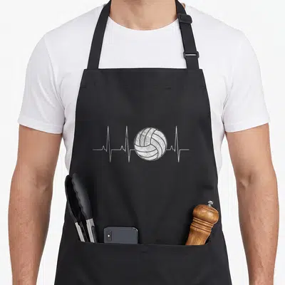 Volleyball a's aprons - White volleyball on grey heartbeat line with distressed texture — shown on a black cotton canvas apron against a white background