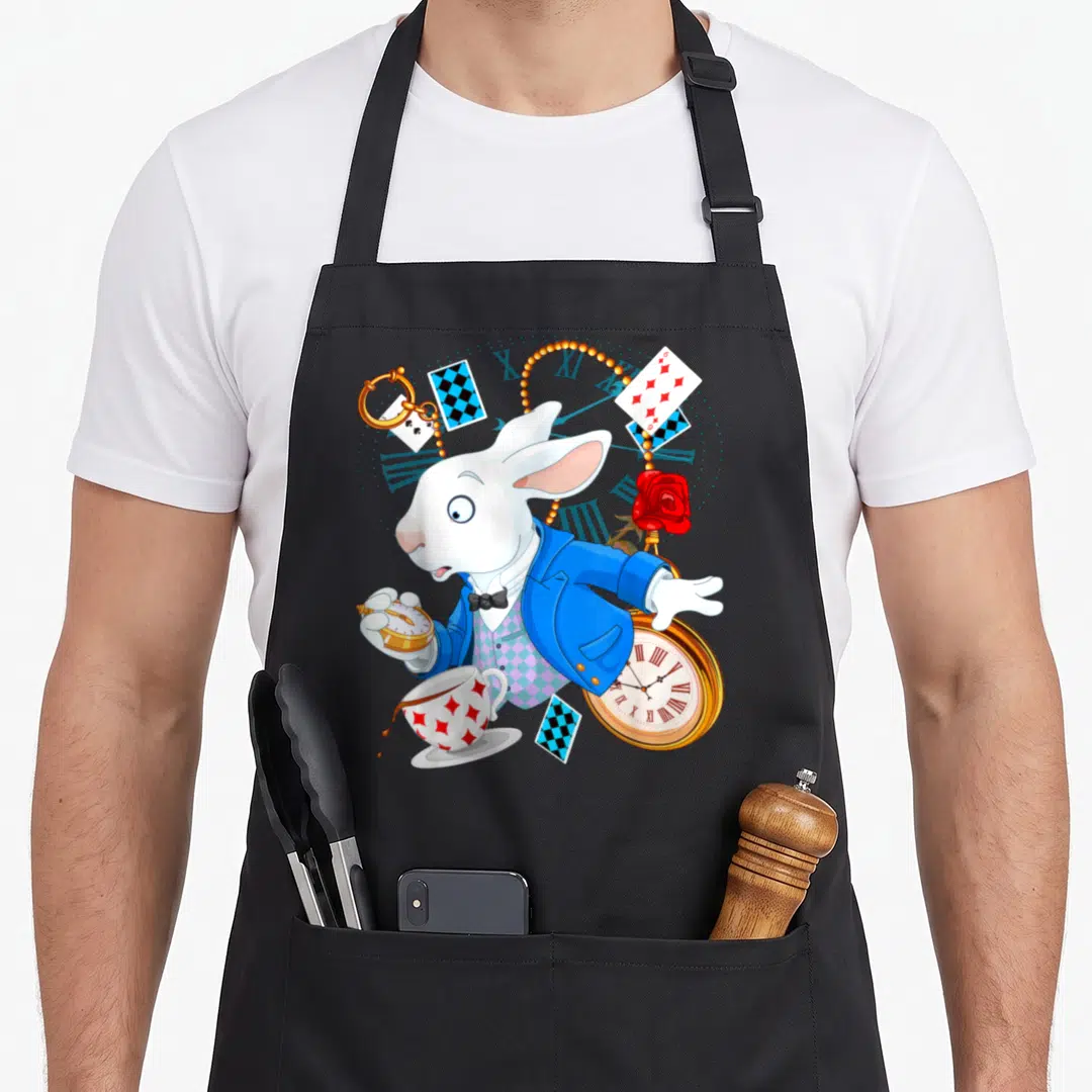 Alice wonderland rabbit apron - White rabbit in blue jacket holding gold pocket watch surrounded by playing cards — shown on a black cotton canvas apron against a white background
