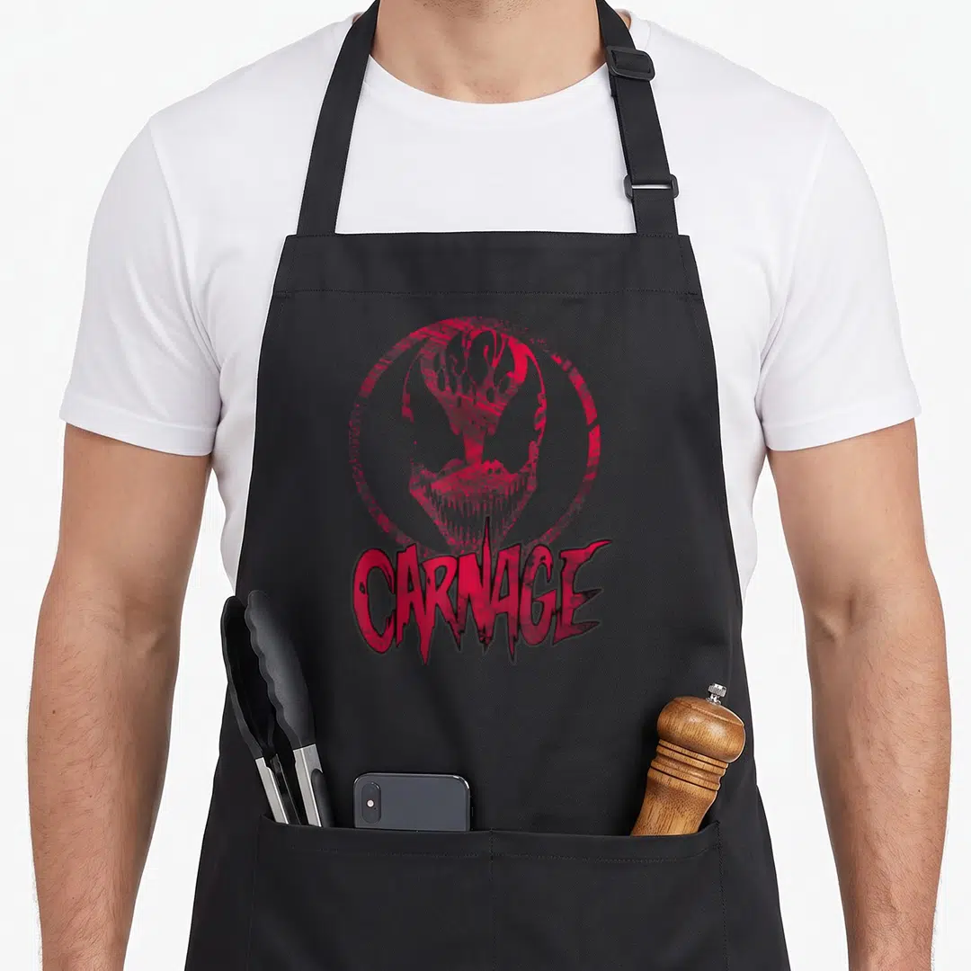 Carnage face apron - Distressed red Carnage face in a circle with matching text below on black fabric — shown on a black cotton canvas apron against a white background