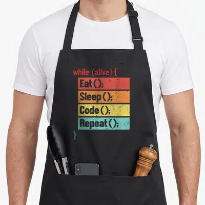 Code engineer apron - Stacked code syntax bars in red orange yellow teal with grey text on grey background — shown on a black cotton canvas apron against a white background