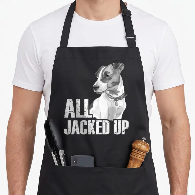 Jacked dog dad apron - Realistic grey and white terrier with stacked ALL JACKED UP text — shown on a black cotton canvas apron against a white background