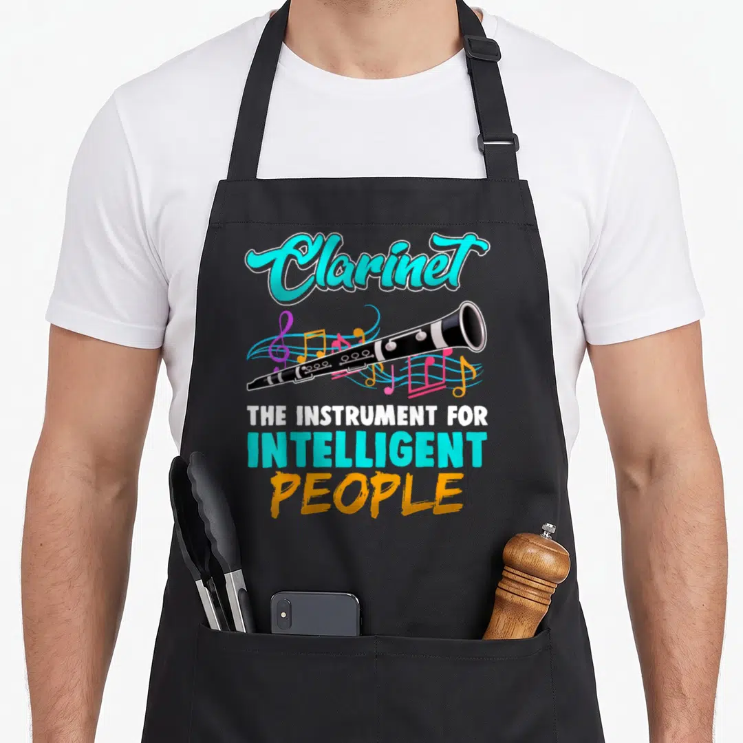 Player clarinet lover apron - Black clarinet with cyan script title and colorful musical notes surrounding the body — shown on a black cotton canvas apron against a white background