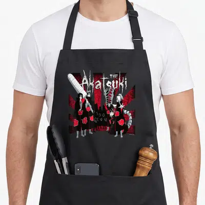 Funny shippuden akatsuki apron - The Akatsuki text above cloak characters and sword on red and white sunburst — shown on a black cotton canvas apron against a white background