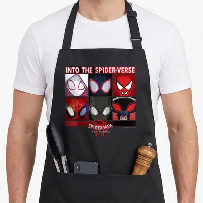 Spiderverse square apron - Six spider-people masks in a 2x3 grid with INTO THE SPIDER-VERSE text and red web art — shown on a black cotton canvas apron against a white background