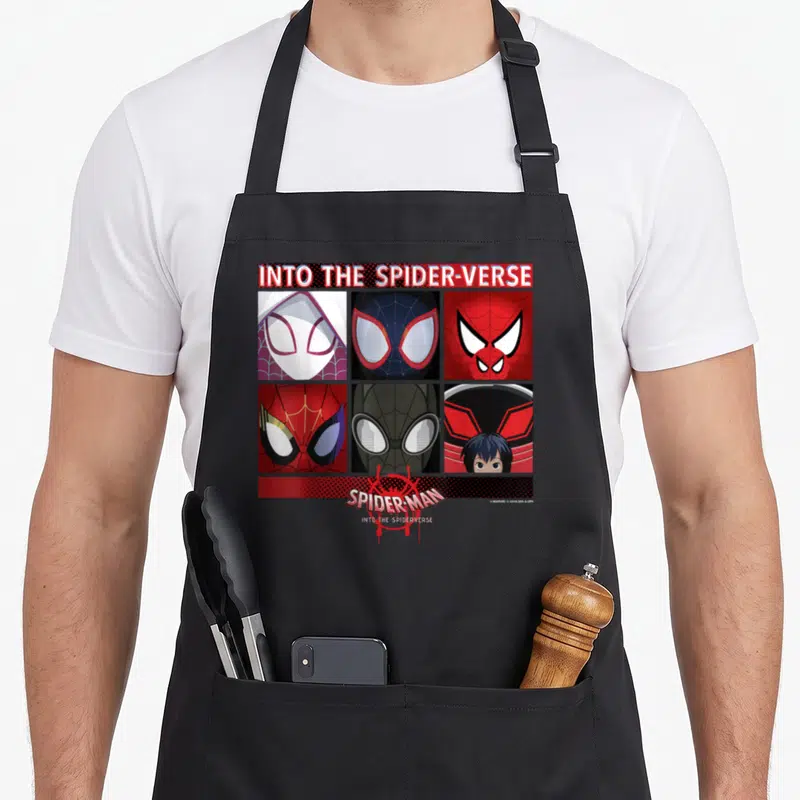 Spiderverse square apron - Six spider-people masks in a 2x3 grid with INTO THE SPIDER-VERSE text and red web art — shown on a black cotton canvas apron against a white background
