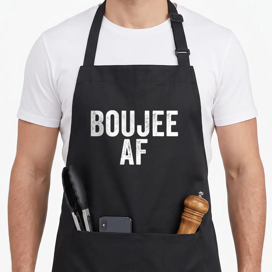Boujee urban apron - White distressed BOUJEE AF text stacked on black bib — shown on a black cotton canvas apron against a white background