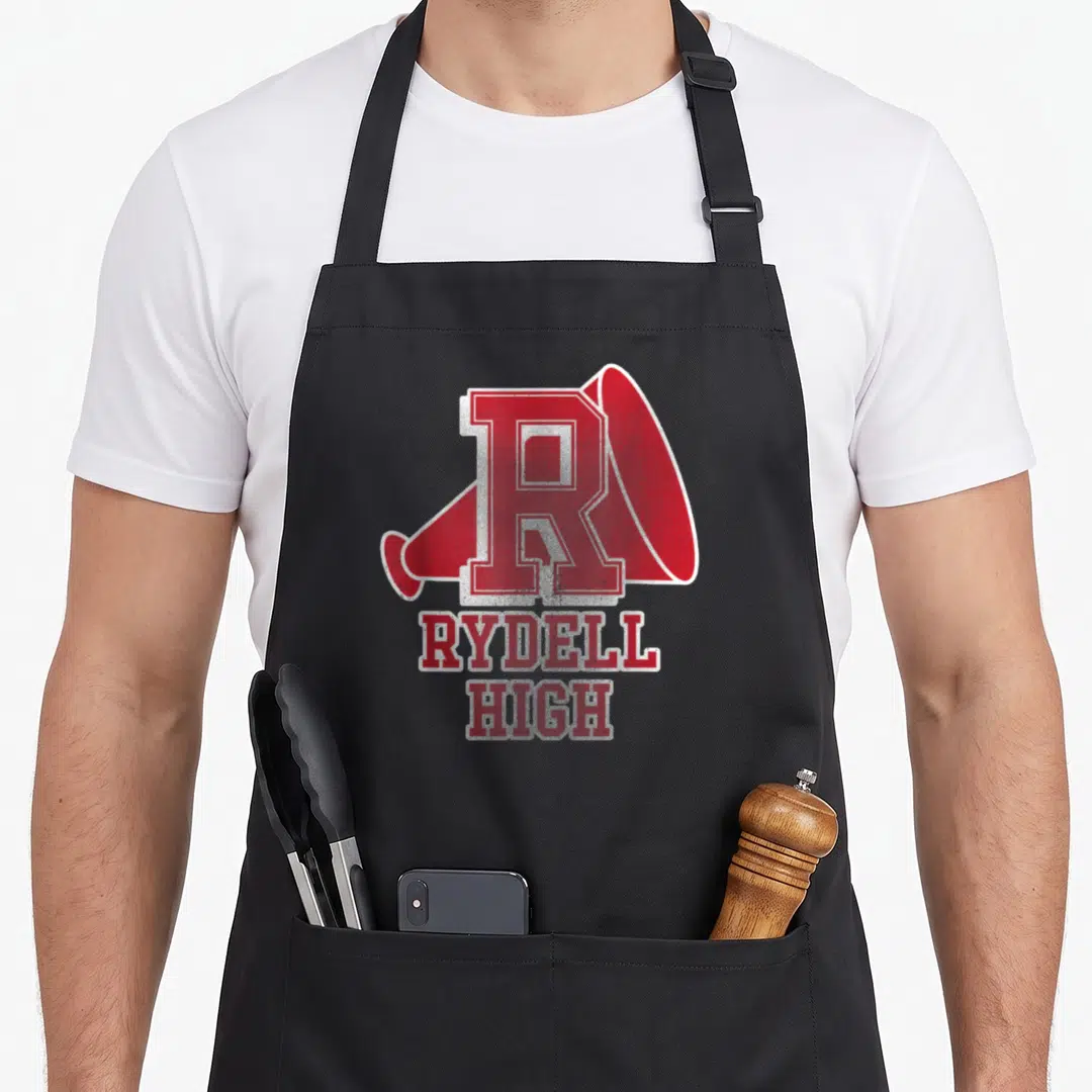 Rydell football apron - Red distressed R over megaphone with RYDELL HIGH stacked text — shown on a black cotton canvas apron against a white background