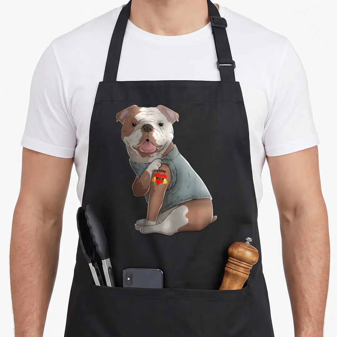 Bulldog tattoo english aprons - Cartoon bulldog in grey sweater with heart tattoo reading I LOVE MOM — shown on a black cotton canvas apron against a white background
