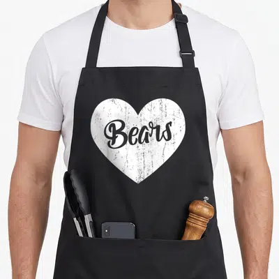 Sport bear apron - Distressed white heart with grey cursive Bears text centered on fabric — shown on a black cotton canvas apron against a white background