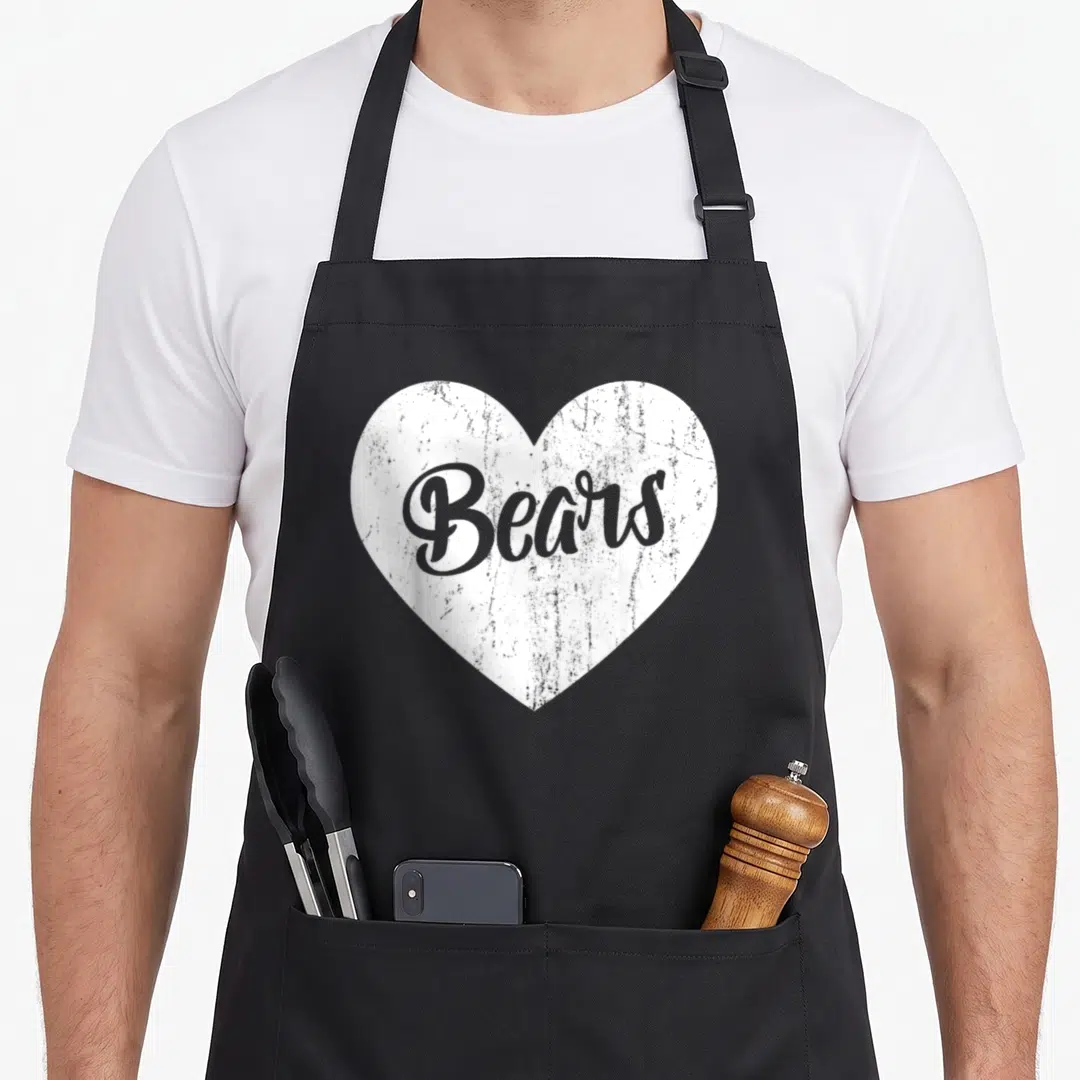 Sport bear apron - Distressed white heart with grey cursive Bears text centered on fabric — shown on a black cotton canvas apron against a white background