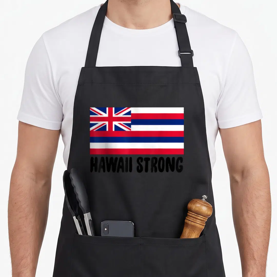 Strong hawaiian apron - Minimalist red white blue black flag above HAWAII STRONG text — shown on a black cotton canvas apron against a white background