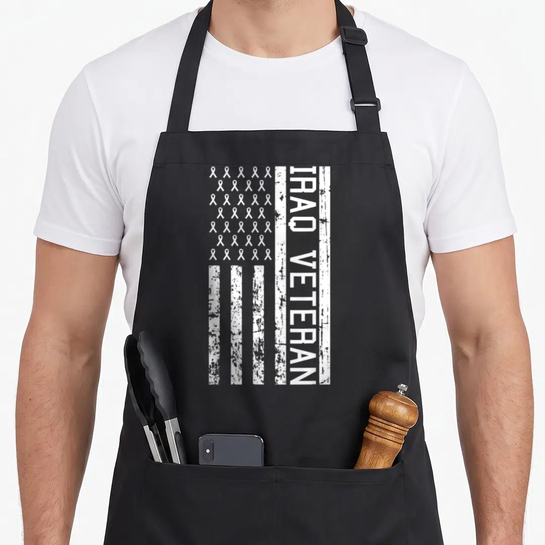 Iraq american flag apron - White flag with ribbon grid and rotated Iraq Veteran text on black fabric — shown on a black cotton canvas apron against a white background