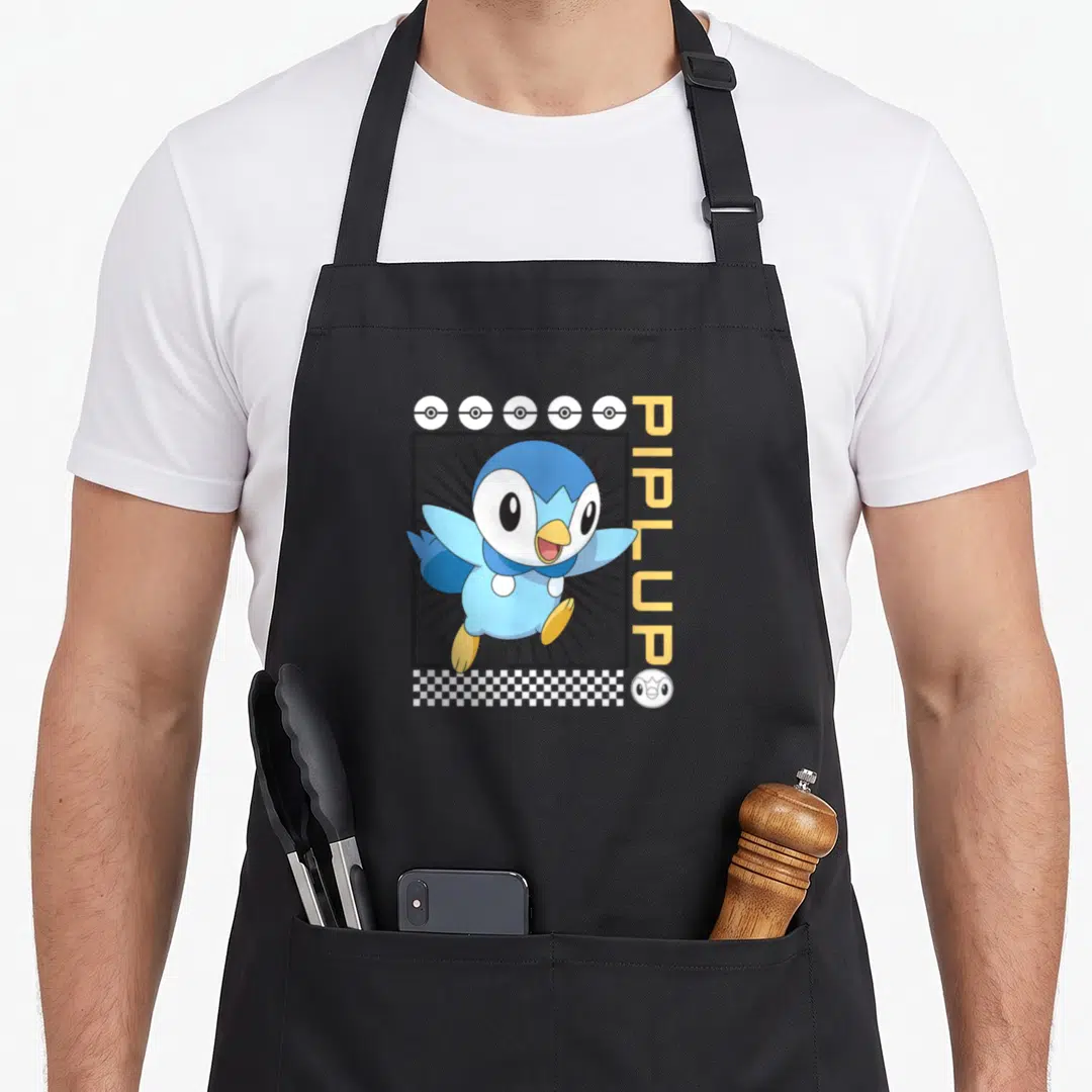 Piplup classical lover apron - Blue Piplup in black frame with vertical yellow text, white pokeballs, and checkerboard — shown on a black cotton canvas apron against a white background