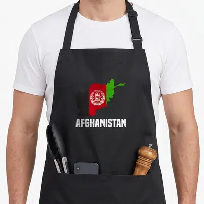 Afghanistan country apron - Map of Afghanistan filled with black red green and white flag colors above white text — shown on a black cotton canvas apron against a white background
