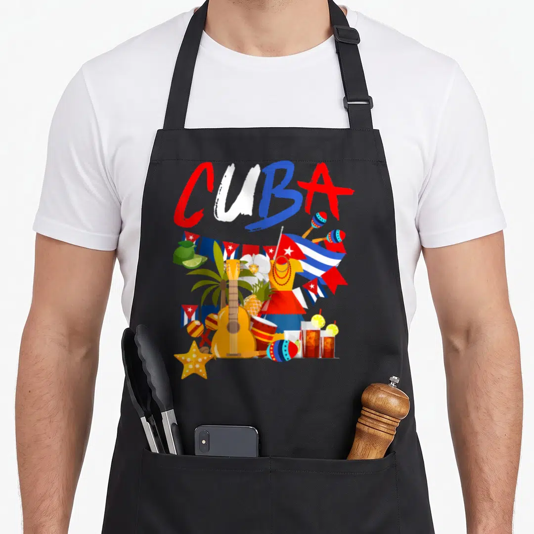 Outfit hispanic aprons - CUBA brush text over flags guitar maracas drinks limes pineapple cartoon — shown on a black cotton canvas apron against a white background