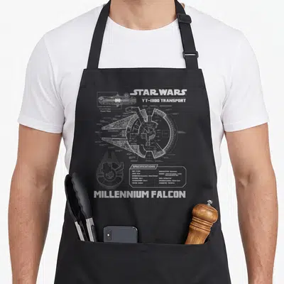 Funny schematic falcon apron - Technical blueprint of YT-1300 Transport ship with specifications table and white line — shown on a black cotton canvas apron against a white background