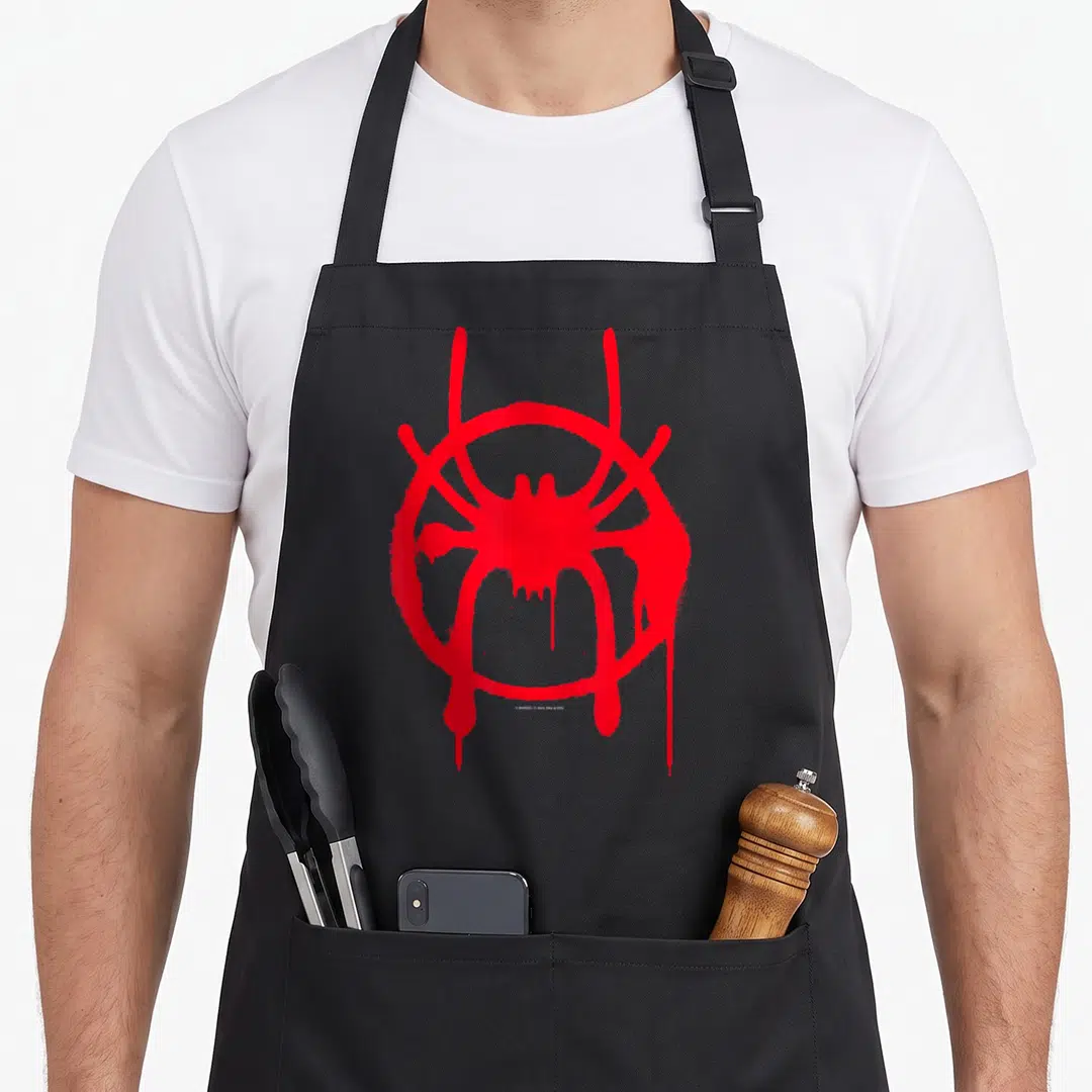 Spiderverse spider apron - Red spray painted spider logo with drips and distressed texture on black background — shown on a black cotton canvas apron against a white background
