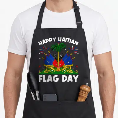 Haitian hungarian boy apron - HAPPY HAITIAN FLAG DAY text surrounding coat of arms with palm tree cannons and flags — shown on a black cotton canvas apron against a white background