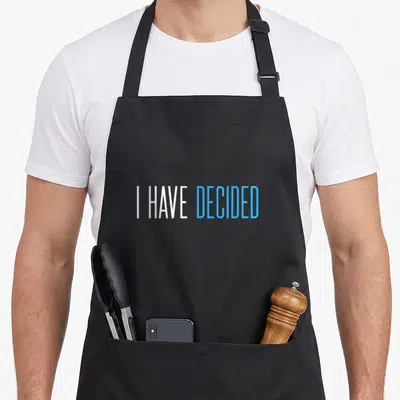 Decided baptism apron - I HAVE DECIDED text in white and blue sans-serif font — shown on a black cotton canvas apron against a white background