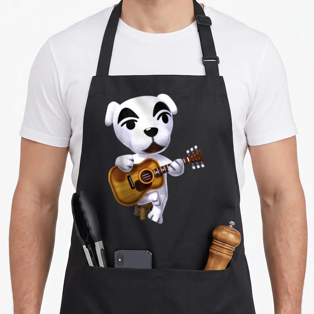 Slider cross apron - White cartoon dog sitting on a stool holding a brown guitar — shown on a black cotton canvas apron against a white background
