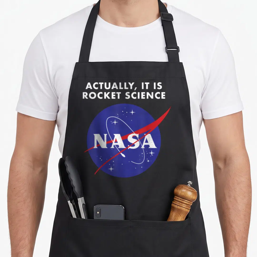 Actually nasa apron - Distressed blue NASA logo with white stars and red swoosh under sarcastic text — shown on a black cotton canvas apron against a white background
