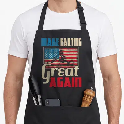 Karting racing apron - Distressed red white blue flag with go-kart driver silhouette and MAKE KARTING Great AGAIN text — shown on a black cotton canvas apron against a white background