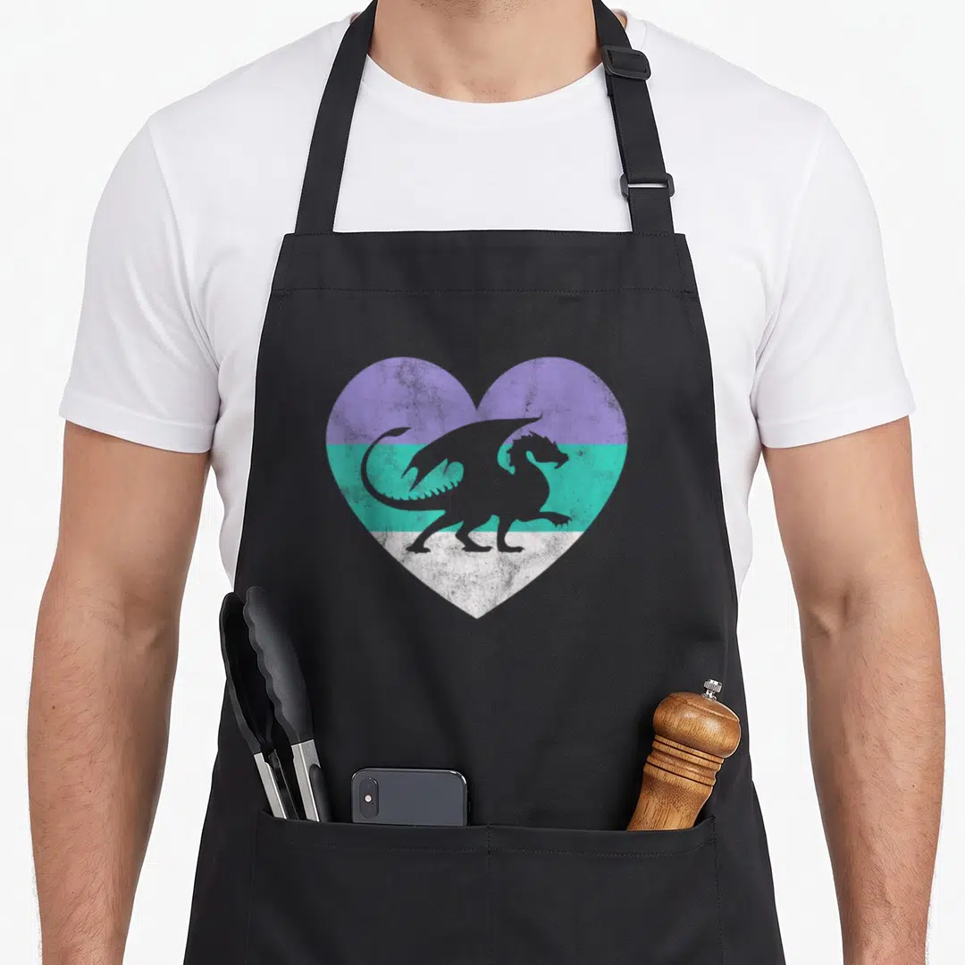 Vintage dragon apron - Grey dragon silhouette on heart with purple teal and white stripes — shown on a black cotton canvas apron against a white background