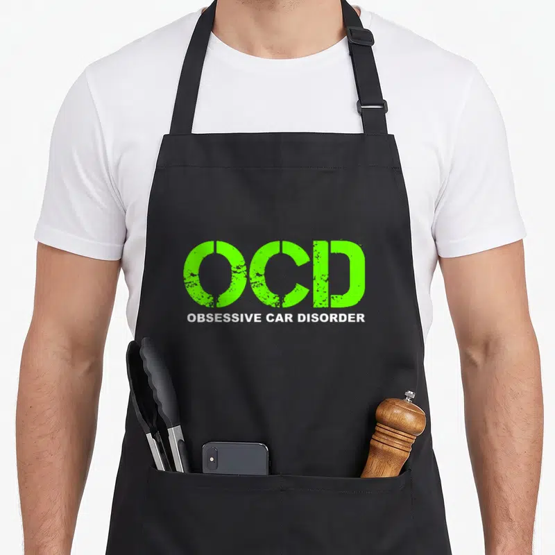 Ocd car apron - Lime green OCD text above white OBSESSIVE CAR DISORDER in distressed font — shown on a black cotton canvas apron against a white background