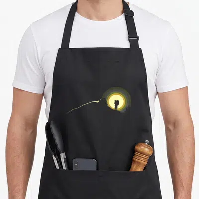 Hiking outdoor backpacking camping apron - Minimalist hiker silhouette in grey and olive circles with yellow sun — shown on a black cotton canvas apron against a white background