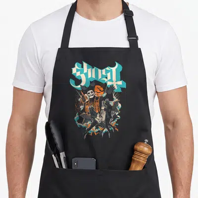 Impera ghost apron - GHOST text above central skeleton with two winged musicians and orange sun — shown on a black cotton canvas apron against a white background