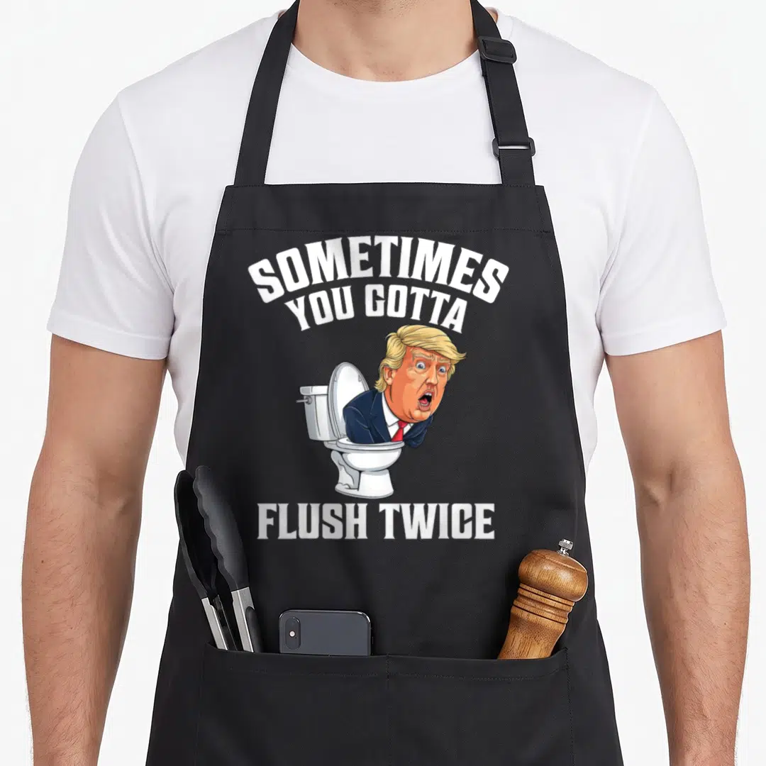 Sometime meme apron - Cartoon man in toilet with Sometimes You Gotta Flush Twice text in white and blue — shown on a black cotton canvas apron against a white background