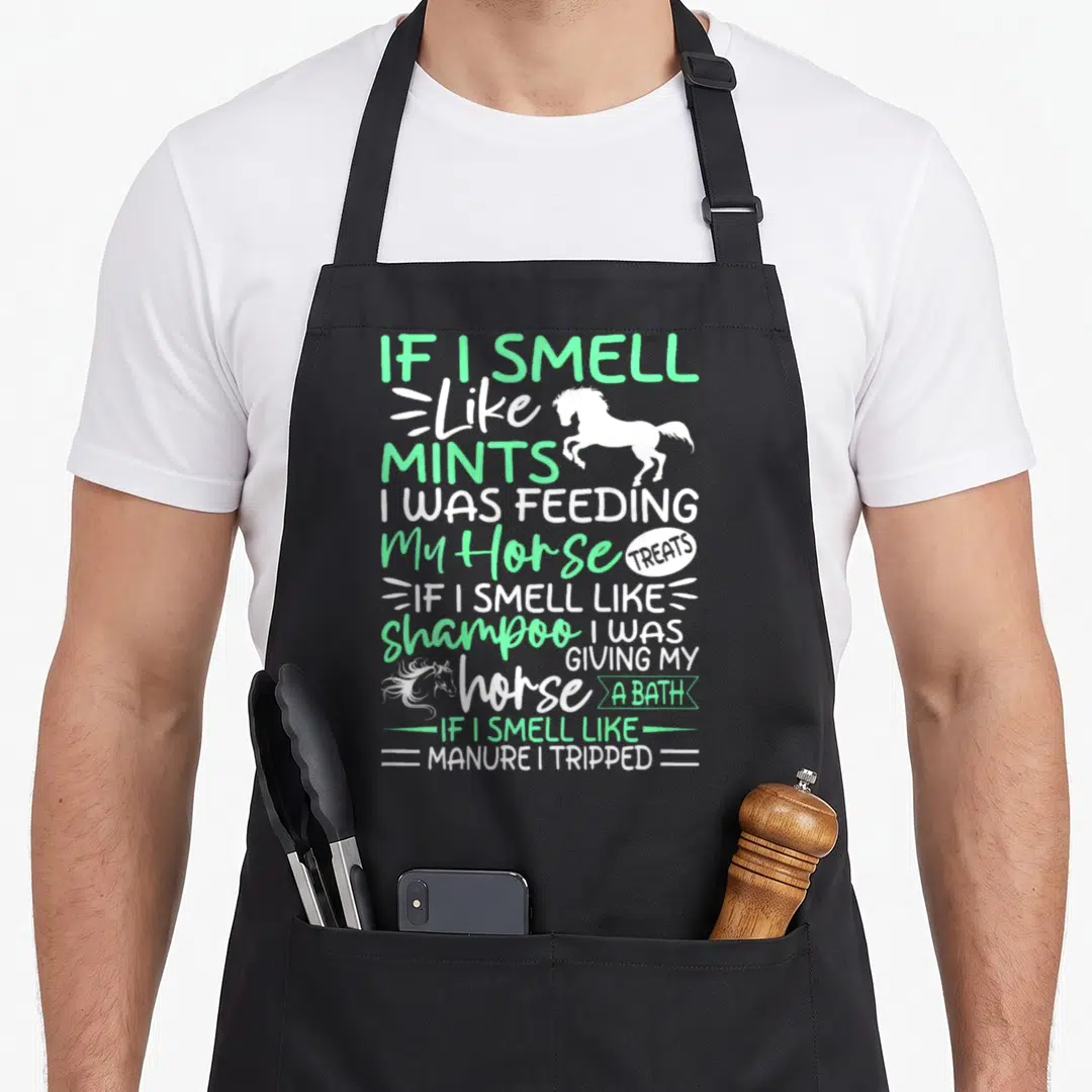 Horse apron for men - Mint green and white stacked text reading If I Smell Like Mints with rearing horse silhouette — shown on a black cotton canvas apron against a white background