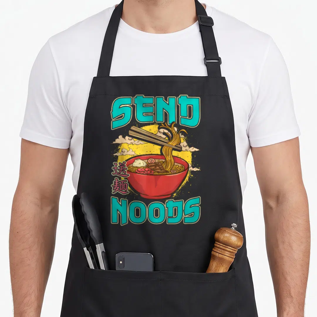 Send pho apron - Teal send noods text above a red bowl of noodles with chopsticks and kanji characters — shown on a black cotton canvas apron against a white background