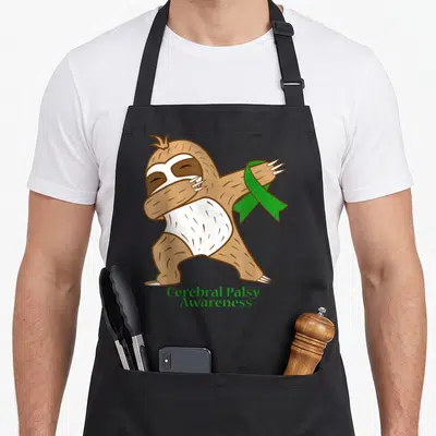 Dabbing ribbon apron - Cartoon sloth dabbing holding green ribbon with Cerebral Palsy Awareness text — shown on a black cotton canvas apron against a white background