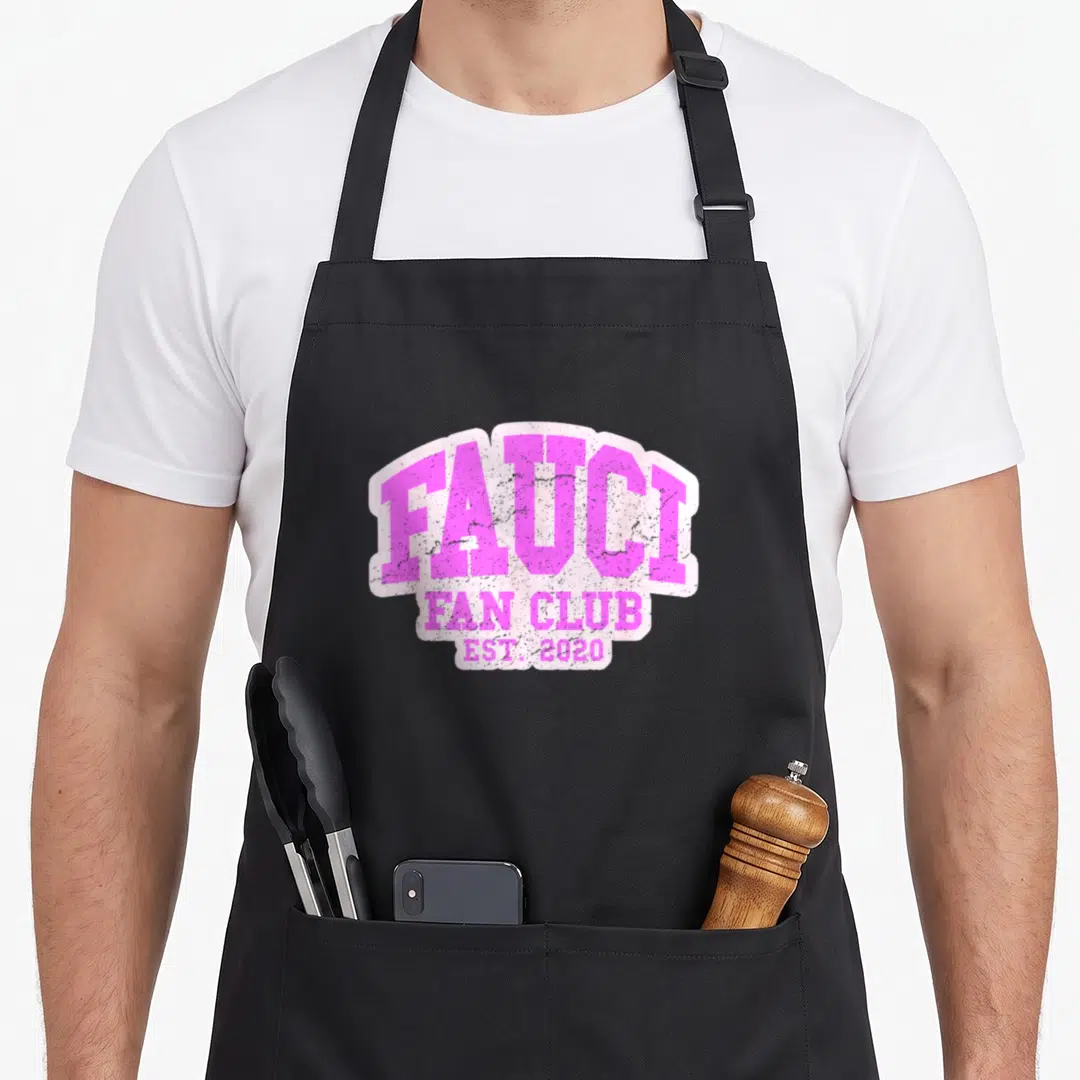 Fan dr apron - Pink distressed typography reading FAUCI FAN CLUB EST. 2020 on white background — shown on a black cotton canvas apron against a white background
