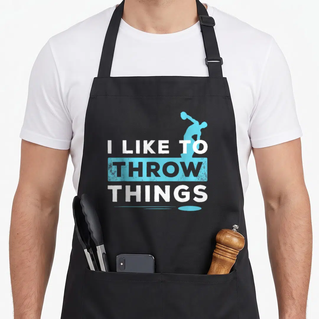 Field discus track apron - I LIKE TO THROW THINGS text with light blue hammer thrower silhouette — shown on a black cotton canvas apron against a white background