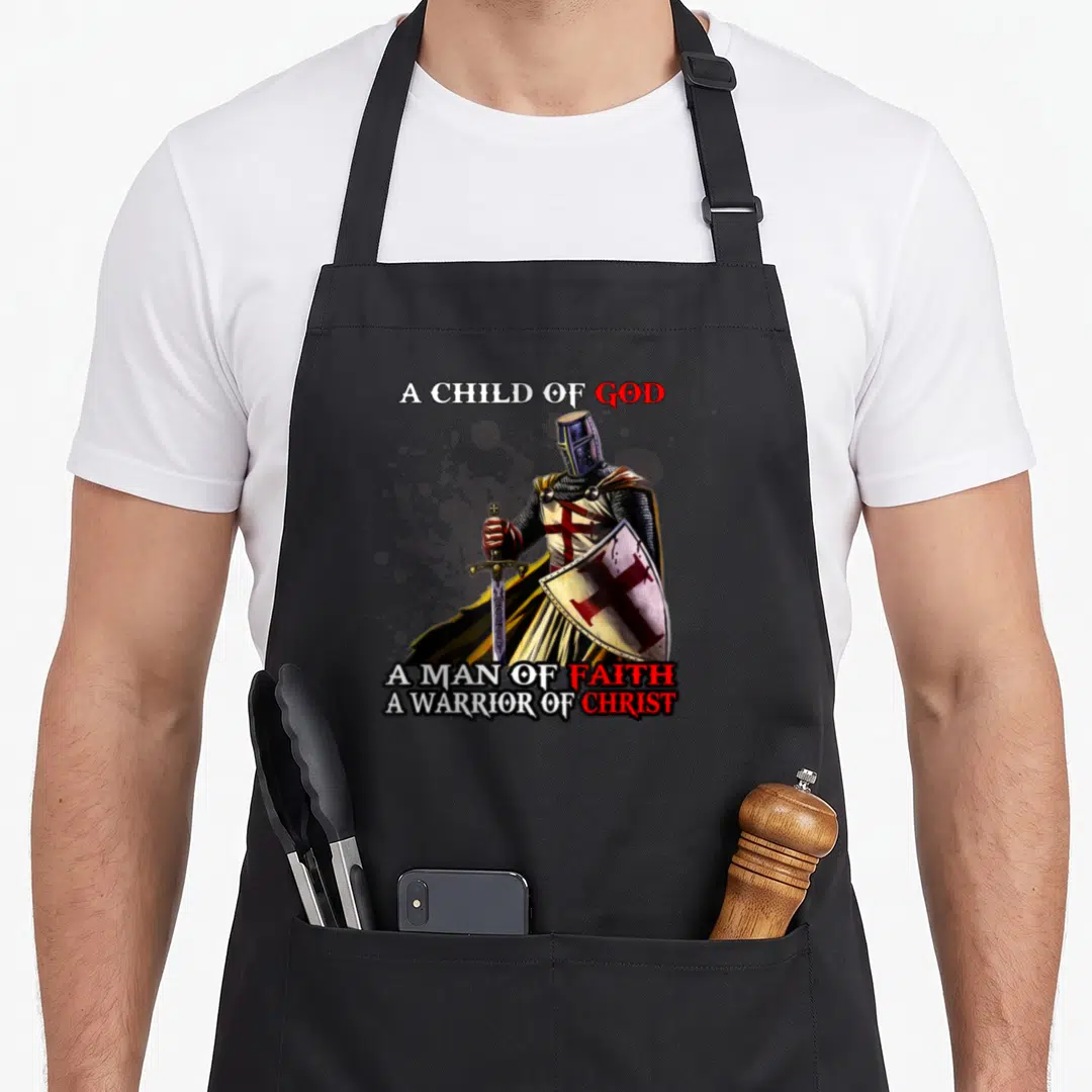 Gospel bible phrase christian apron - Realistic knight with sword and red cross shield surrounded by text A Child — shown on a black cotton canvas apron against a white background