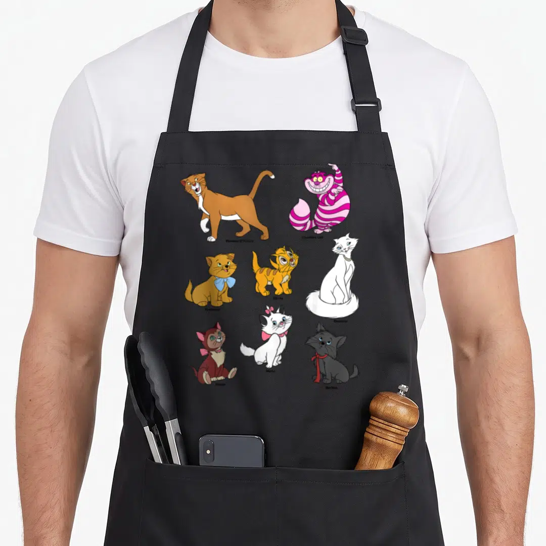 Portrait cat apron - Eight cartoon cats labeled Thomas OMalley, Cheshire Cat, Toulouse, Oliver, Duchess, Dinah, Marie — shown on a black cotton canvas apron against a white background